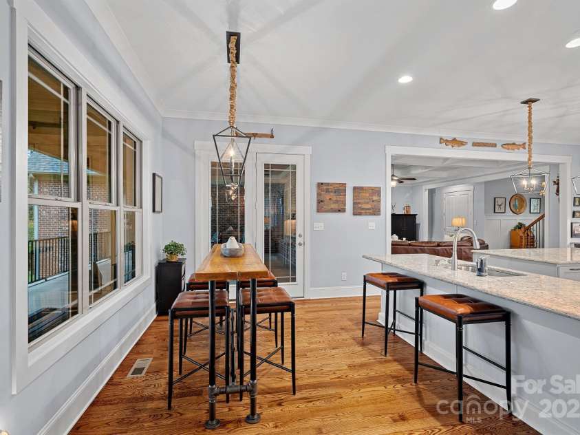 4637 Gold Finch Drive, Denver, NC 28037.  MLS# CAR4243866, YatesRealty ID 5930. Doors leading out onto the back porch off of the dining area.