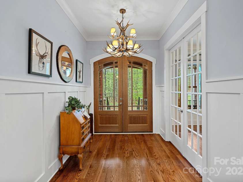 4637 Gold Finch Drive, Denver, NC 28037.  MLS# CAR4243866, YatesRealty ID 5930. Once you step through the grand double doors you are greeted with beautiful hardwoods and a board and batten lined foyer.