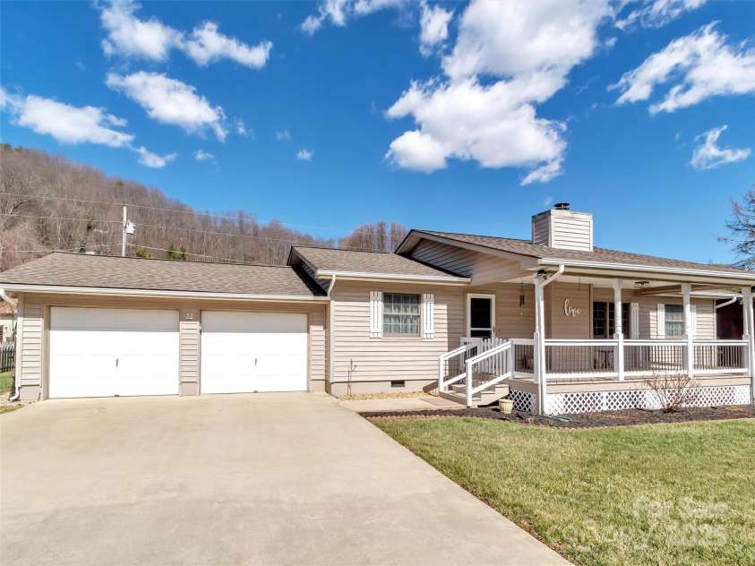 52 Sunflower Lane, Waynesville, NC 28785.  MLS# CAR4225373, YatesRealty ID 5933. Inviting Covered Front Porch