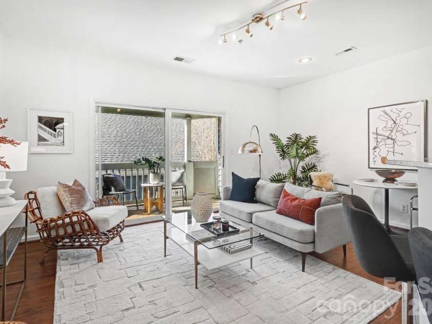 525 Graham Street, Charlotte, NC 28202.  MLS# CAR4341824, YatesRealty ID 5934. Bright Living Room that Opens to a Private Balcony—Perfect for Morning Coffee or Evening Views.