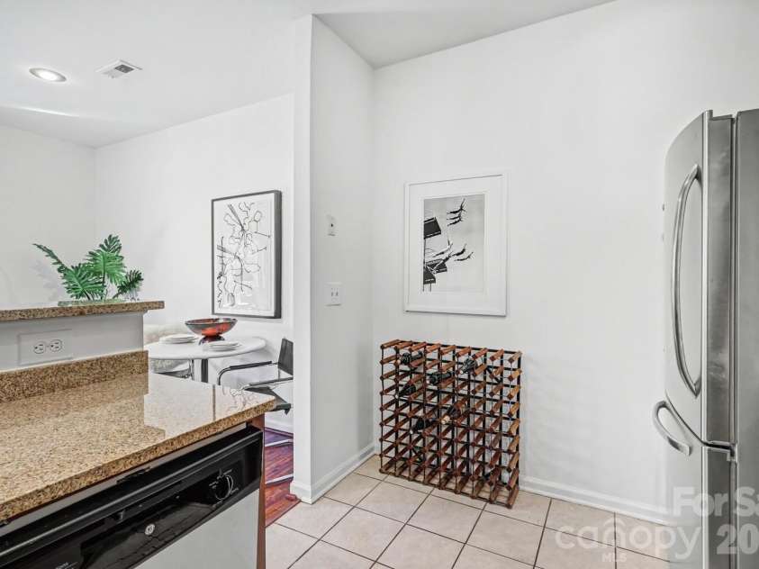 525 Graham Street, Charlotte, NC 28202.  MLS# CAR4341824, YatesRealty ID 5934. Dedicated space for dining (in living area) with plenty of room for a wine rack in the kitchen.