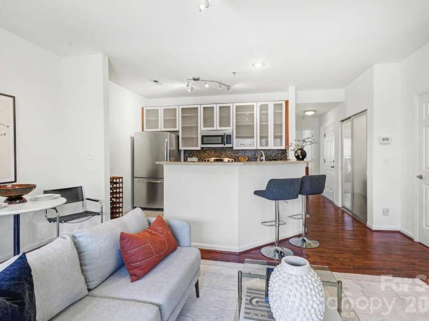 525 Graham Street, Charlotte, NC 28202.  MLS# CAR4341824, YatesRealty ID 5934. Flowing layout where the kitchen and living room work beautifully together. There's even room for a table for dining or working from home.