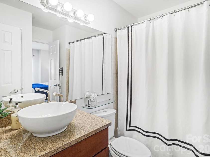 525 Graham Street, Charlotte, NC 28202.  MLS# CAR4341824, YatesRealty ID 5934. Stylish, easy-care bathroom designed for everyday living.