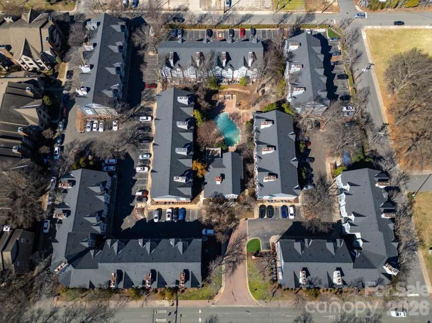 525 Graham Street, Charlotte, NC 28202.  MLS# CAR4341824, YatesRealty ID 5934. The 4th Ward Condo Complex - your balcony on the 3rd floor overlook the pool in one direction and the skyline in the other.