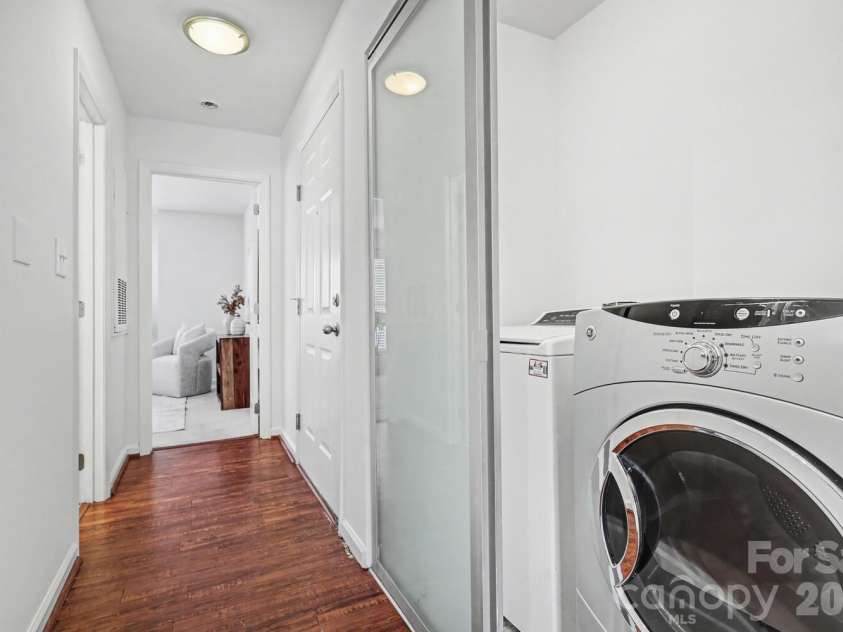 525 Graham Street, Charlotte, NC 28202.  MLS# CAR4341824, YatesRealty ID 5934. Well-planned hallway with convenient in-unit laundry and clear flow to the bedroom. Washer and dryer convey!