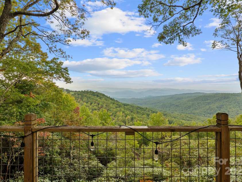 243 Ridgeline Drive, Brevard, NC 28712.  MLS# CAR4313542, YatesRealty ID 5944. Guest Cottage Deck View