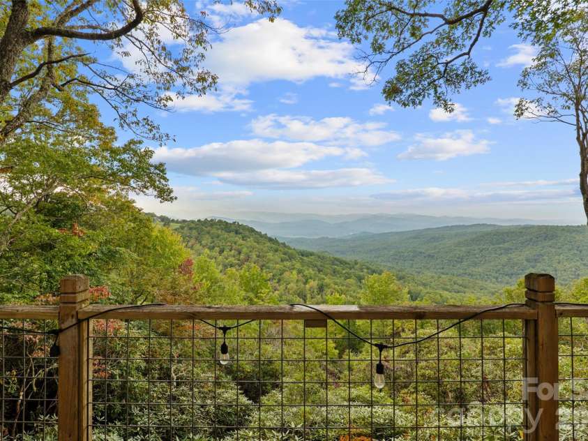 243 Ridgeline Drive, Brevard, NC 28712.  MLS# CAR4313542, YatesRealty ID 5944. Guest Cottage Deck View
