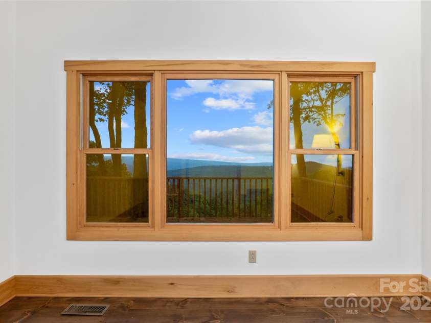 243 Ridgeline Drive, Brevard, NC 28712.  MLS# CAR4313542, YatesRealty ID 5944. Main House Bedroom