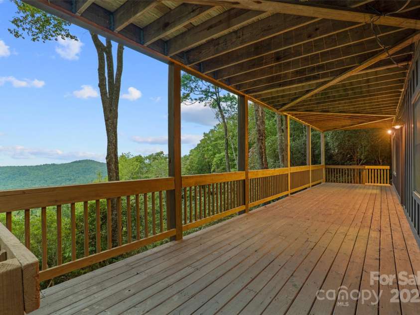 243 Ridgeline Drive, Brevard, NC 28712.  MLS# CAR4313542, YatesRealty ID 5944. Main House Lower Deck