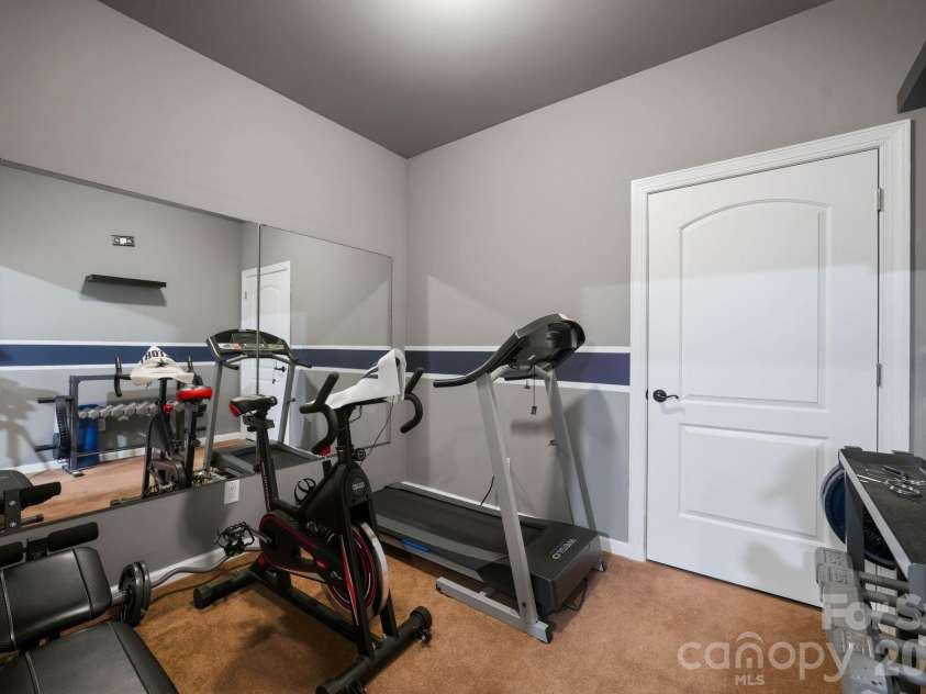 8407 Rolling Fields Road, Mint Hill, NC 28227.  MLS# CAR4436729, YatesRealty ID 59477. Exercise studio (lower level)