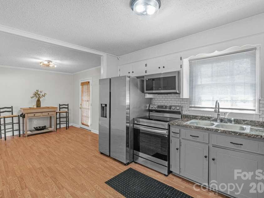 708 John Street, Matthews, NC 28105.  MLS# CAR4353646, YatesRealty ID 5948. 