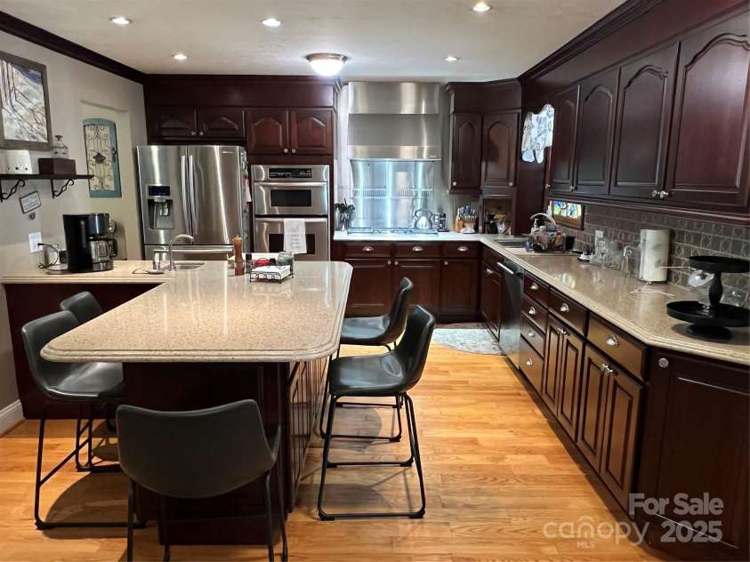 901 Ridge Street, Albemarle, NC 28001.  MLS# CAR4247010, YatesRealty ID 5950. Kitchen with breakfast bar