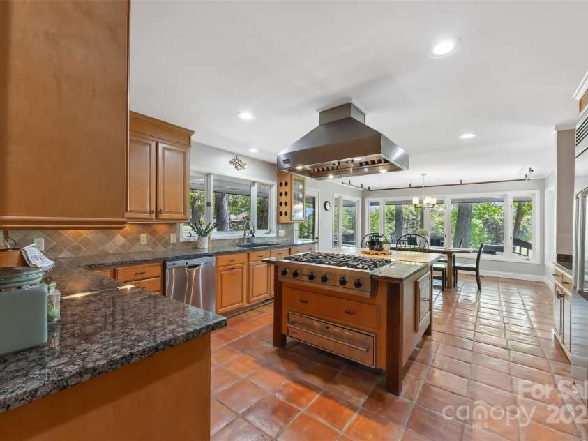 21 Hollyberry Woods, Lake Wylie, SC 29710.  MLS# CAR4241992, YatesRealty ID 5963. Spanish style terracotta flooring in this well equipped kitchen.