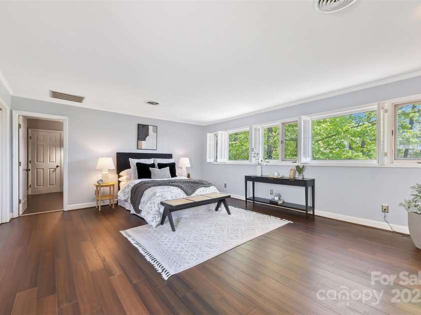 21 Hollyberry Woods, Lake Wylie, SC 29710.  MLS# CAR4241992, YatesRealty ID 5963. Upstairs primary suite complete with another wall of windows.