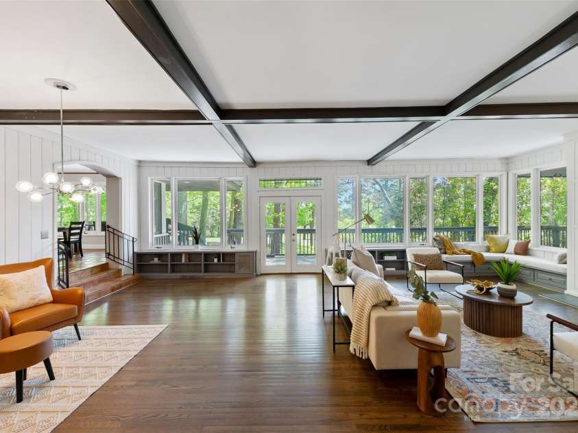 21 Hollyberry Woods, Lake Wylie, SC 29710.  MLS# CAR4241992, YatesRealty ID 5963. Wall of windows overlooking the wrap around deck and 9th fairway.