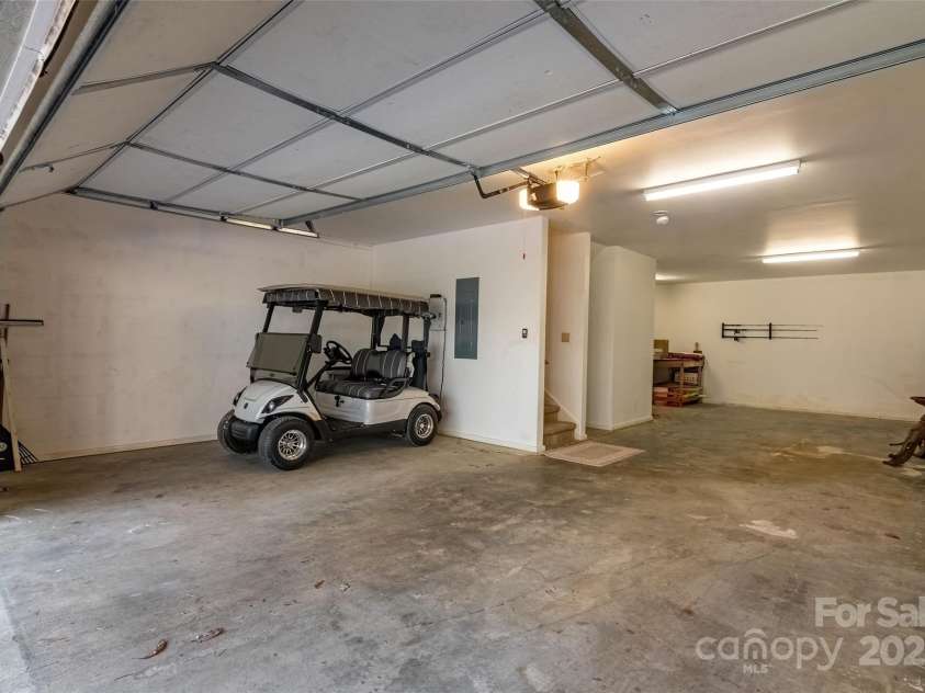 620 Sapphire Valley Road, Cashiers, NC 28717.  MLS# CAR4329121, YatesRealty ID 598. 840 square foot double car garage with a storage room and workshop area in back, and still room for your golf cart on the side.!
