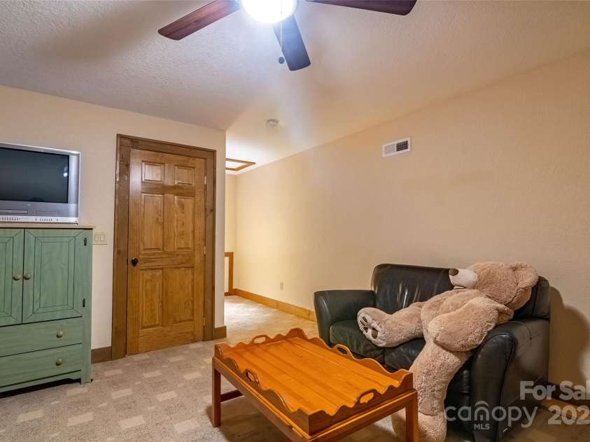 620 Sapphire Valley Road, Cashiers, NC 28717.  MLS# CAR4329121, YatesRealty ID 598. Bunk Room Suite Sitting Area at the top of the stairs from the 2nd floor. All furniture here conveys. The bears await your arrival.!