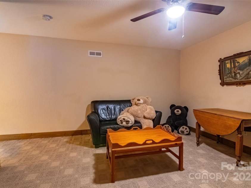 620 Sapphire Valley Road, Cashiers, NC 28717.  MLS# CAR4329121, YatesRealty ID 598. Bunk Room Suite Sitting Area at the top of the stairs from the 2nd floor. All furniture here conveys. The bears await your arrival.!