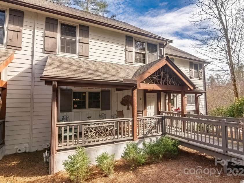 620 Sapphire Valley Road, Cashiers, NC 28717.  MLS# CAR4329121, YatesRealty ID 598. Front of unit C with its cool sitting porch and ramp to the front door.