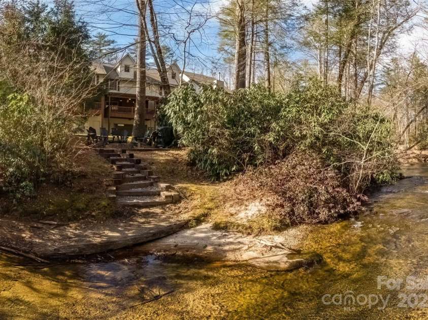 620 Sapphire Valley Road, Cashiers, NC 28717.  MLS# CAR4329121, YatesRealty ID 598. In the trees you see the covered wooden deck on the rear of Unit 