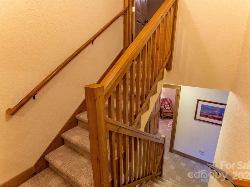 620 Sapphire Valley Road, Cashiers, NC 28717.  MLS# CAR4329121, YatesRealty ID 598. Staircase from second floor to the cool and oddly shaped 3rd floor bunk room.