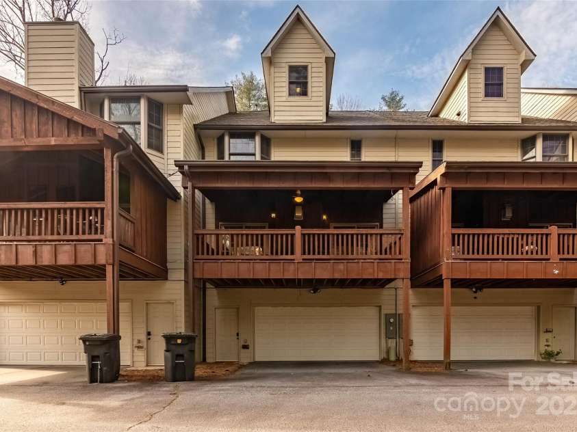 620 Sapphire Valley Road, Cashiers, NC 28717.  MLS# CAR4329121, YatesRealty ID 598. The rear of the Hampton Glen 6 building. The middle garage door is Unit 