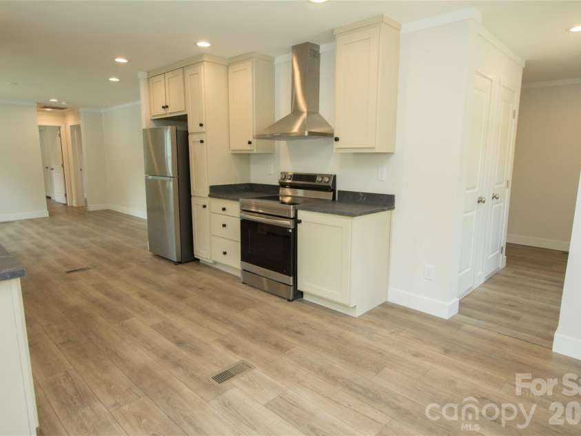 30 Babb Street, Waynesville, NC 28786.  MLS# CAR4280509, YatesRealty ID 5981. Laundry room off Kitchen