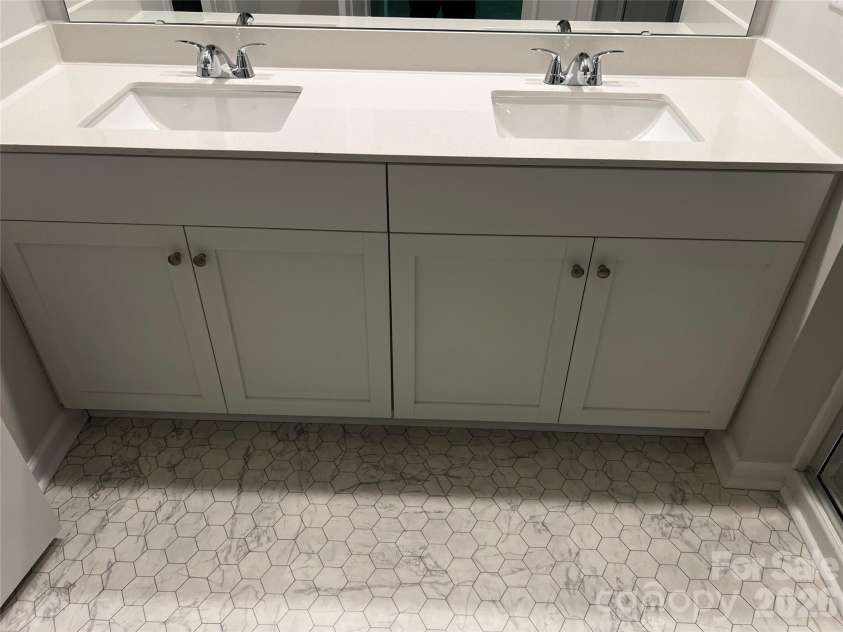 4608 Green Drake Drive, Charlotte, NC 28269.  MLS# CAR4277845, YatesRealty ID 5983. Vanities in primary bathroom