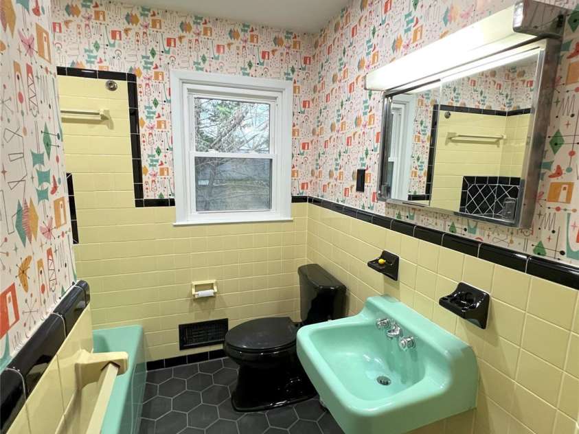 612 Brown Avenue, Albemarle, NC 28001.  MLS# CAR4119824, YatesRealty ID 5995. Hall Bathroom - vintage restored tile/tub