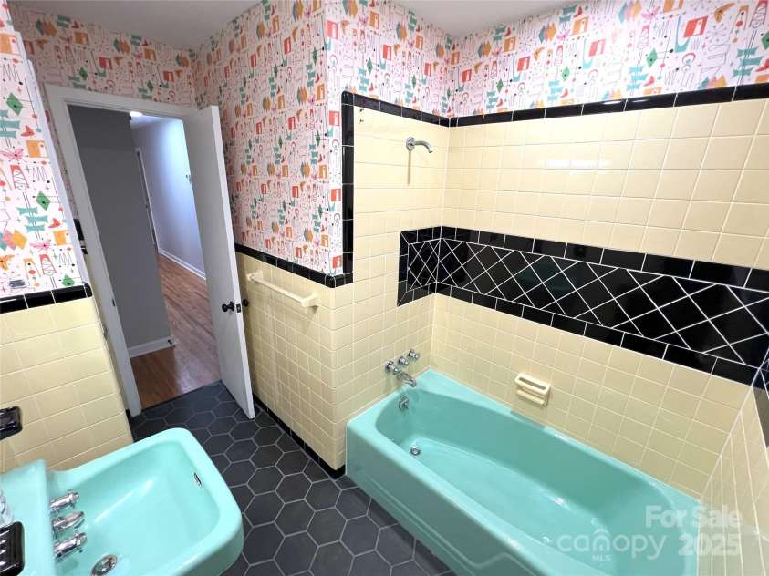 612 Brown Avenue, Albemarle, NC 28001.  MLS# CAR4119824, YatesRealty ID 5995. Hall Bathroom - vintage restored tile/tub