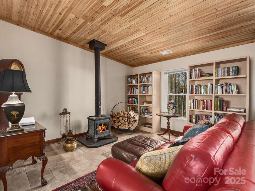 173 Cherokee Springs Trail, Hendersonville, NC 28739.  MLS# CAR4233123, YatesRealty ID 5997. Living Room with cozy wood burning stove