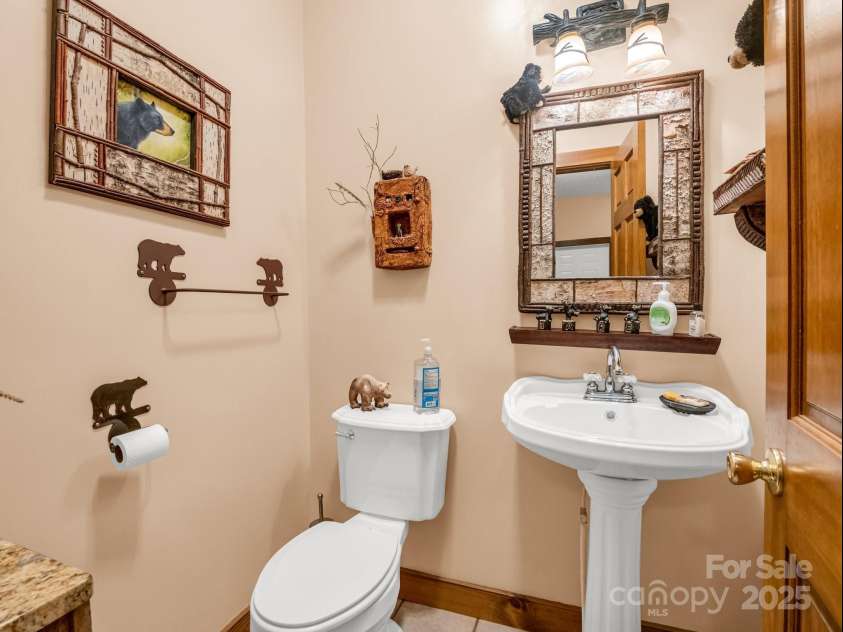 560 Charleys Knob Road, Pisgah Forest, NC 28768.  MLS# CAR4246535, YatesRealty ID 6002. 1/2 bath off of kitchen