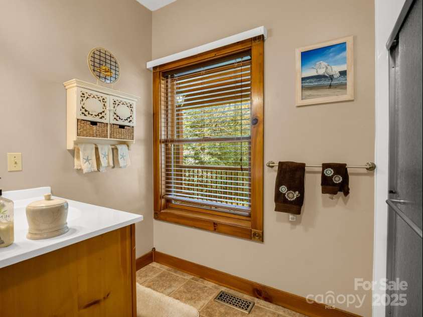 560 Charleys Knob Road, Pisgah Forest, NC 28768.  MLS# CAR4246535, YatesRealty ID 6002. Full bath main level hall