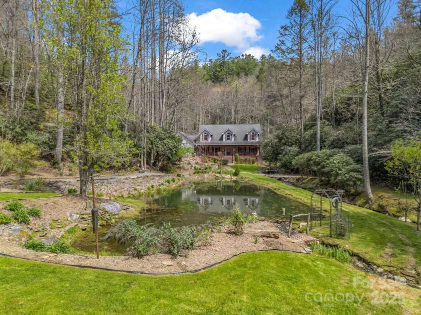 560 Charleys Knob Road, Pisgah Forest, NC 28768.  MLS# CAR4246535, YatesRealty ID 6002. Pond, bold stream and waterfall