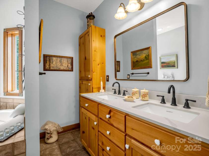 560 Charleys Knob Road, Pisgah Forest, NC 28768.  MLS# CAR4246535, YatesRealty ID 6002. Primary bath