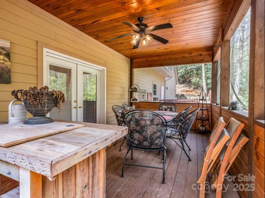 560 Charleys Knob Road, Pisgah Forest, NC 28768.  MLS# CAR4246535, YatesRealty ID 6002. Screened rear porch