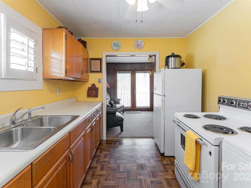 338 Morgan Road, Candler, NC 28715.  MLS# CAR4224621, YatesRealty ID 6004. Kitchen in garage apartment