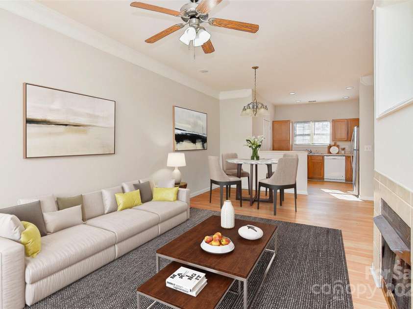 6512 Quarterbridge Lane, Charlotte, NC 28262.  MLS# CAR4242993, YatesRealty ID 6005. Welcoming Living area. (Virtually staged)
