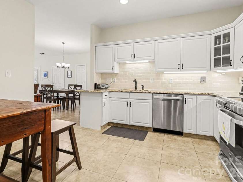 8327 Olde Troon Drive, Charlotte, NC 28277.  MLS# CAR4345406, YatesRealty ID 6006. Kitchen looking to the dining room