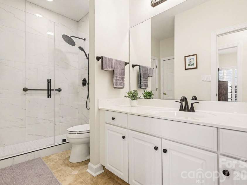 8327 Olde Troon Drive, Charlotte, NC 28277.  MLS# CAR4345406, YatesRealty ID 6006. New second bathroom step in shower with grab bars