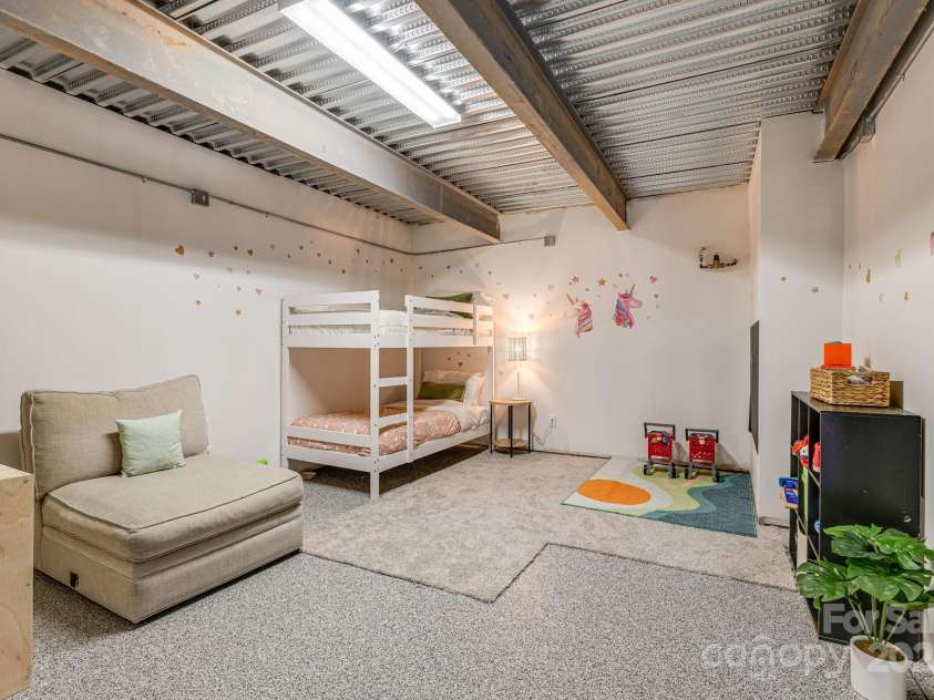 52 Kirby Road, Asheville, NC 28806.  MLS# CAR4227031, YatesRealty ID 6008. Currently unfinished bonus room, not counted in heated and cooled square footage