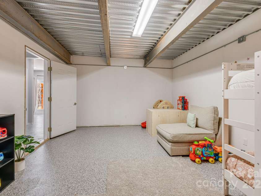 52 Kirby Road, Asheville, NC 28806.  MLS# CAR4227031, YatesRealty ID 6008. Currently unfinished bonus room, not counted in heated and cooled square footage