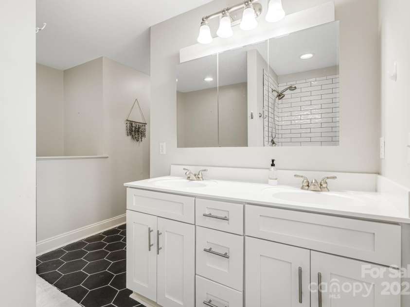 52 Kirby Road, Asheville, NC 28806.  MLS# CAR4227031, YatesRealty ID 6008. Double vanity in main bathroom