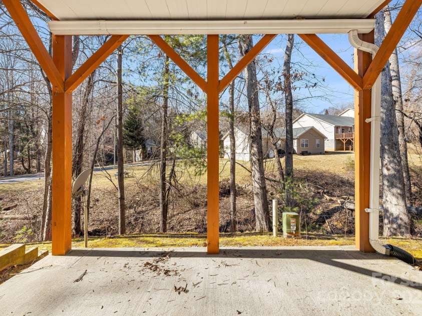 52 Kirby Road, Asheville, NC 28806.  MLS# CAR4227031, YatesRealty ID 6008. Downstairs back patio