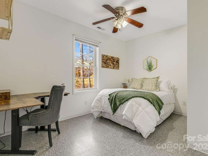 52 Kirby Road, Asheville, NC 28806.  MLS# CAR4227031, YatesRealty ID 6008. Downstairs bedroom with lots of natural light
