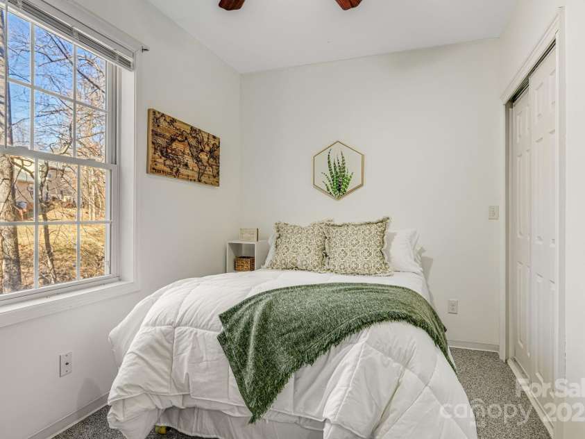 52 Kirby Road, Asheville, NC 28806.  MLS# CAR4227031, YatesRealty ID 6008. Downstairs bedroom with lots of natural light