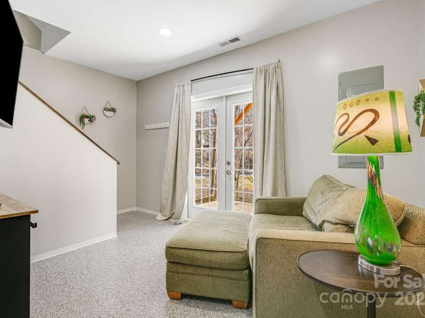 52 Kirby Road, Asheville, NC 28806.  MLS# CAR4227031, YatesRealty ID 6008. Downstairs living space with entrance to outside