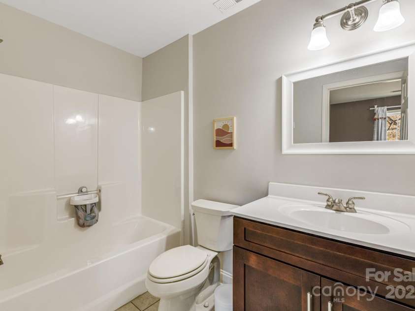 52 Kirby Road, Asheville, NC 28806.  MLS# CAR4227031, YatesRealty ID 6008. En suite bathroom