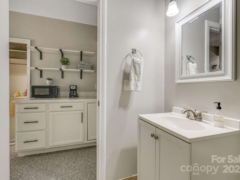 52 Kirby Road, Asheville, NC 28806.  MLS# CAR4227031, YatesRealty ID 6008. Full bath downstairs room