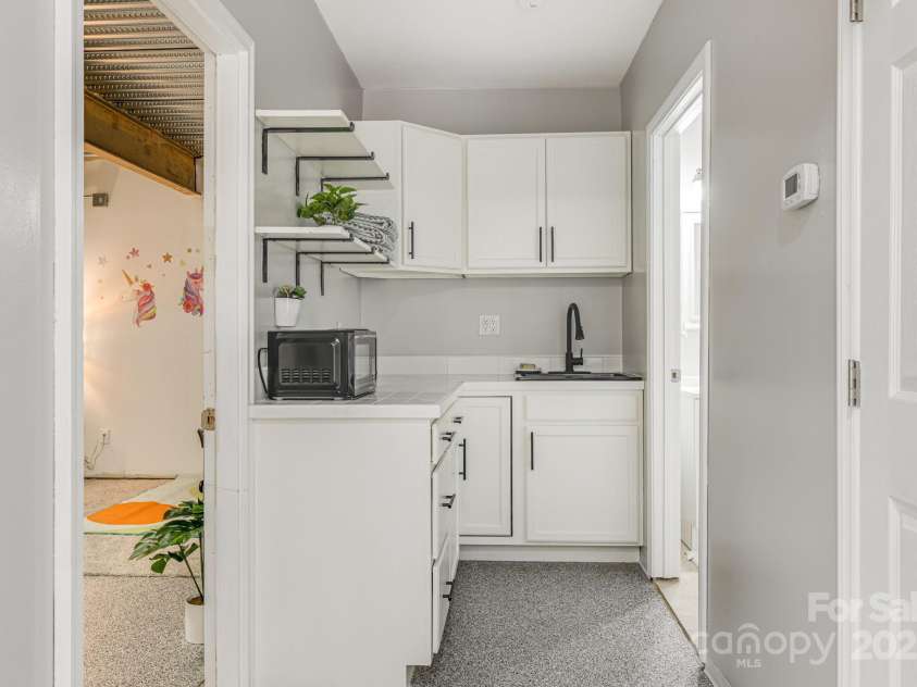 52 Kirby Road, Asheville, NC 28806.  MLS# CAR4227031, YatesRealty ID 6008. Second kitchen in the downstairs space